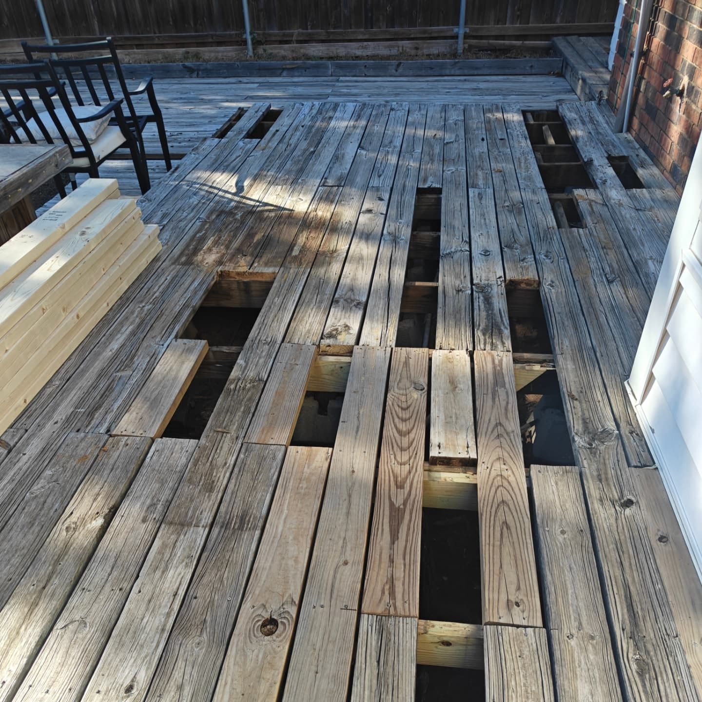 Rotted deck boards pulled up before Curb Appeal replaced them