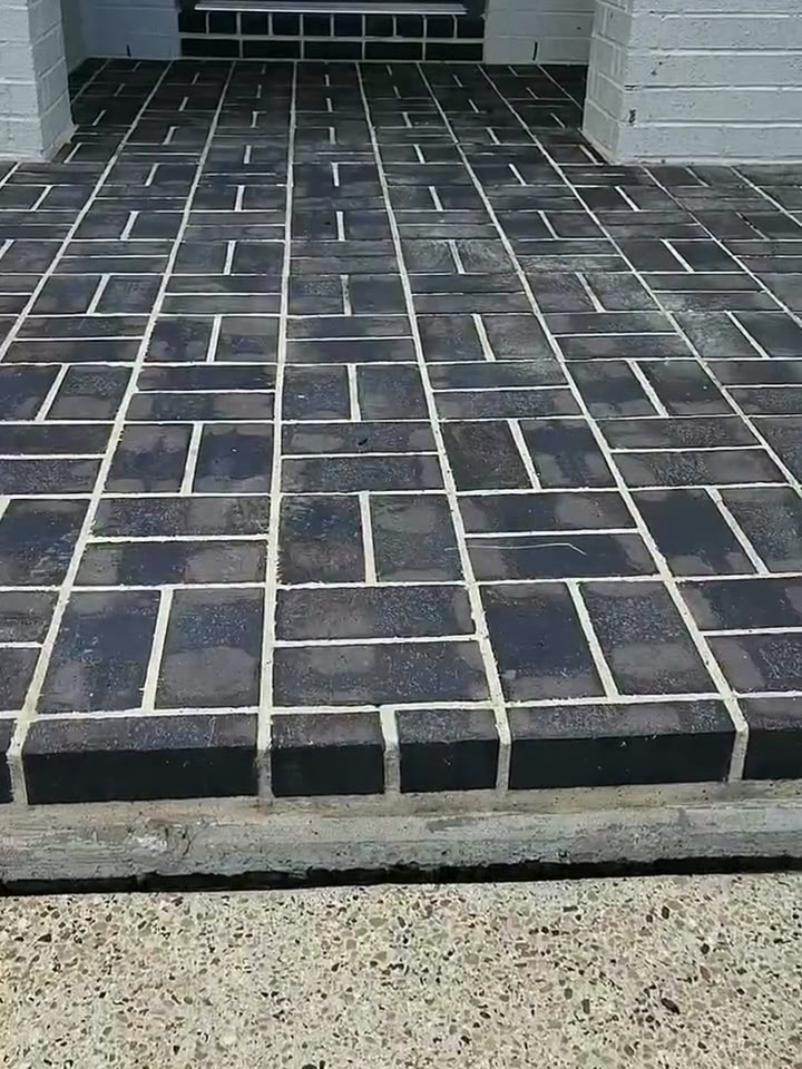 A Curb Appeal job site: freshly washed pavers and concrete, the surfaces clean and dry